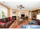Living room with a fireplace, television, and display cabinet at 833 Gaston Manor Dr, Durham, NC 27703