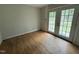 Bedroom featuring hardwood floors and French doors at 8535 Us-301 S Hwy, Four Oaks, NC 27524