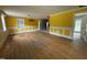 Large living room with hardwood floors and natural light from the adjacent kitchen at 8535 Us-301 S Hwy, Four Oaks, NC 27524