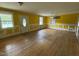 Bright living room featuring hardwood floors, trim, and a large window at 8535 Us-301 S Hwy, Four Oaks, NC 27524