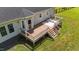 Aerial view of back deck with outdoor seating and a white outdoor rug at 8700 Crowder Rd, Raleigh, NC 27603