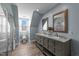 Bright bathroom with a double vanity, tiled shower, and window at 8700 Crowder Rd, Raleigh, NC 27603
