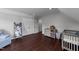 Bright bedroom with hardwood floors, neutral paint colors, and lots of storage space at 8700 Crowder Rd, Raleigh, NC 27603