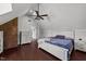 Primary bedroom featuring wood floors, ensuite bath and brick accent wall at 8700 Crowder Rd, Raleigh, NC 27603