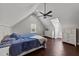 Spacious bedroom with ceiling fan and multiple windows at 8700 Crowder Rd, Raleigh, NC 27603