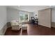 Spacious bonus room with accent chair and desk, and a half brick wall at 8700 Crowder Rd, Raleigh, NC 27603