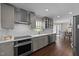 Modern kitchen featuring stainless steel appliances, white countertops, and a subway tile backsplash at 8700 Crowder Rd, Raleigh, NC 27603