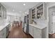 Well-lit kitchen featuring stainless steel appliances, modern countertops, and hardwood floors at 8700 Crowder Rd, Raleigh, NC 27603