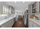 Well-lit kitchen featuring stainless steel appliances, modern countertops, and hardwood floors at 8700 Crowder Rd, Raleigh, NC 27603