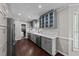 Modern kitchen with stainless steel appliances, white countertops, and gray cabinets at 8700 Crowder Rd, Raleigh, NC 27603