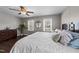 Relaxing main bedroom with hardwood floors, a ceiling fan, and lots of natural light at 8700 Crowder Rd, Raleigh, NC 27603