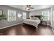 Spacious main bedroom with hardwood floors, lots of natural light, and neutral paint colors at 8700 Crowder Rd, Raleigh, NC 27603