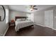 Bright main bedroom with hardwood floors, plenty of natural light, and views of the outdoors at 8700 Crowder Rd, Raleigh, NC 27603