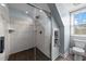 Modern tiled shower with glass door and built-in storage niche at 8700 Crowder Rd, Raleigh, NC 27603