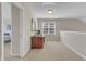 Attic space with neutral carpet and desk with natural light from the windows at 9005 River Estates Dr, Knightdale, NC 27545