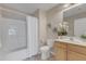 Bathroom featuring a tub, shower, commode, cabinet and mirror at 9005 River Estates Dr, Knightdale, NC 27545