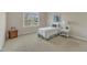 Cozy bedroom with a twin bed, side table, and large window at 9005 River Estates Dr, Knightdale, NC 27545