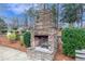 Stone fireplace, seating and landscaping in the community park at 9005 River Estates Dr, Knightdale, NC 27545