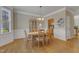 Dining room features a light-colored table, hardwood floors, and a china cabinet at 9005 River Estates Dr, Knightdale, NC 27545