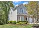 Charming brick home with two-car garage, lush green lawn, and attractive landscaping at 9005 River Estates Dr, Knightdale, NC 27545