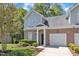 Charming brick home featuring a well-manicured lawn, two-car garage, and inviting front porch at 9005 River Estates Dr, Knightdale, NC 27545