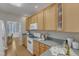 Bright kitchen with hardwood floors, white appliances, and wood cabinets perfect for cooking and entertaining at 9005 River Estates Dr, Knightdale, NC 27545