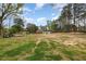 A spacious backyard with large trees at 903 Creech Rd, Garner, NC 27529