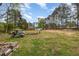 A spacious backyard with large trees at 903 Creech Rd, Garner, NC 27529