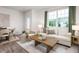 Bright living room boasts natural light, modern furniture, and stylish decor, creating an inviting atmosphere at 102 Red Maple St, Sanford, NC 27332