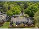 Aerial view of home exteriors and backyards, showcasing parking and abundant trees for serene living at 1020 Randolph Ct, Cary, NC 27511