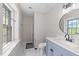 Bright bathroom featuring marble floors, modern sink, and ample lighting at 1020 Randolph Ct, Cary, NC 27511