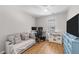 Cozy bedroom space with a couch, desk, and playful toy kitchen at 1020 Randolph Ct, Cary, NC 27511