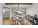 Dining room with stylish light fixture and a glass table with access to backyard patio at 1020 Randolph Ct, Cary, NC 27511