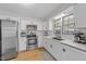 Updated kitchen with stainless steel appliances and white cabinets at 1020 Randolph Ct, Cary, NC 27511