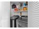 Bright laundry room with shelving, storage, washer, and dryer at 1020 Randolph Ct, Cary, NC 27511