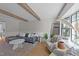 Bright living room with exposed beams, stylish furnishings, and large windows at 1020 Randolph Ct, Cary, NC 27511