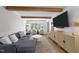 Bright living room with exposed beams, stylish furnishings, and large windows at 1020 Randolph Ct, Cary, NC 27511
