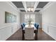 Elegant dining room featuring coffered ceilings, large windows, and stylish decor at 1033 Laredo Ln, Durham, NC 27703
