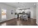 Modern kitchen with stainless steel appliances, granite countertops, and an eat-in island at 1033 Laredo Ln, Durham, NC 27703