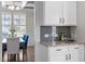 Kitchen nook with granite countertops, stainless steel appliances, and white cabinetry at 1033 Laredo Ln, Durham, NC 27703