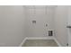 Empty laundry room with tile flooring and white walls at 1033 Laredo Ln, Durham, NC 27703