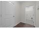 Entry to laundry room with tile flooring and white door at 1033 Laredo Ln, Durham, NC 27703
