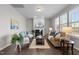 Bright and airy living room featuring a fireplace, hardwood floors, and stylish neutral furniture at 1033 Laredo Ln, Durham, NC 27703