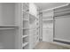 Organized walk-in closet with built-in shelves, drawers, and ample storage space at 1033 Laredo Ln, Durham, NC 27703