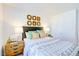 Cozy bedroom featuring neutral decor, decorative pillows, and bedside lamps creating a relaxing atmosphere at 104 Red Maple St, Sanford, NC 27332