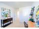 Charming bedroom featuring a wooden desk, bright artwork, and shelving unit at 104 Red Maple St, Sanford, NC 27332