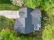 A house captured from above highlighting the outdoor patio area, surrounding trees, and overall property layout at 105 Hein Dr, Clayton, NC 27527