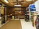Partially finished basement with pegboard, storage racks and concrete floor at 105 Hein Dr, Clayton, NC 27527