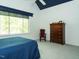Bedroom with soft carpet, window that brings in plenty of natural light, chest of drawers, and a cozy rocking chair at 105 Hein Dr, Clayton, NC 27527
