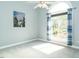 Bright bedroom with large windows, neutral carpet, and a nature-themed art print at 105 Hein Dr, Clayton, NC 27527